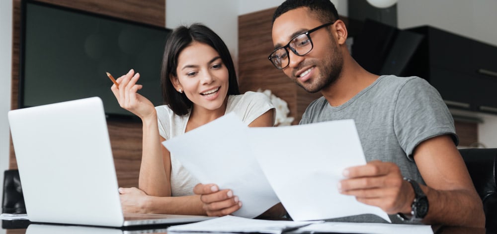Man and Woman Reviewing Finances 